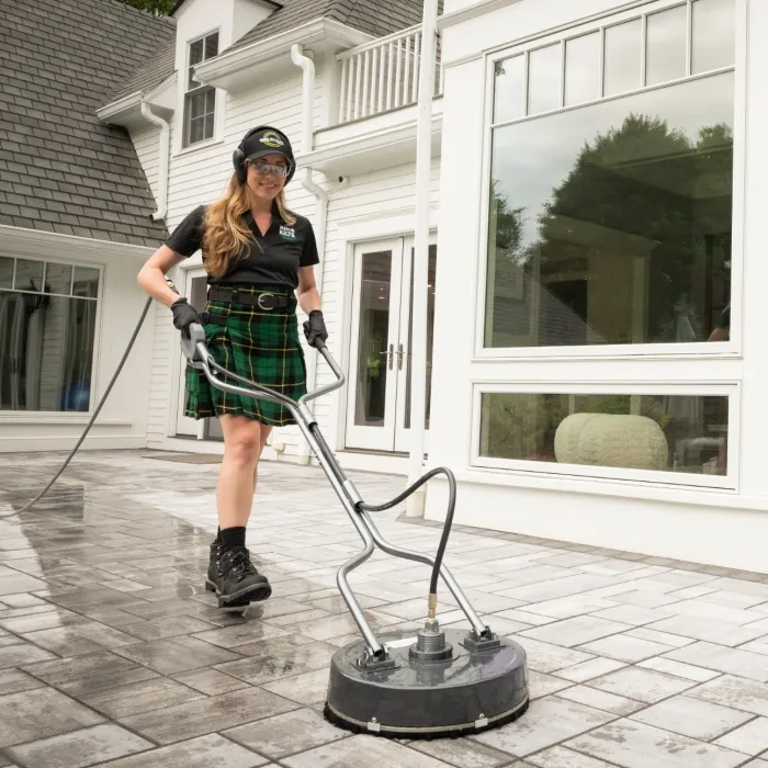 a woman in a kilt standing next to a man in a kilt and a kilt