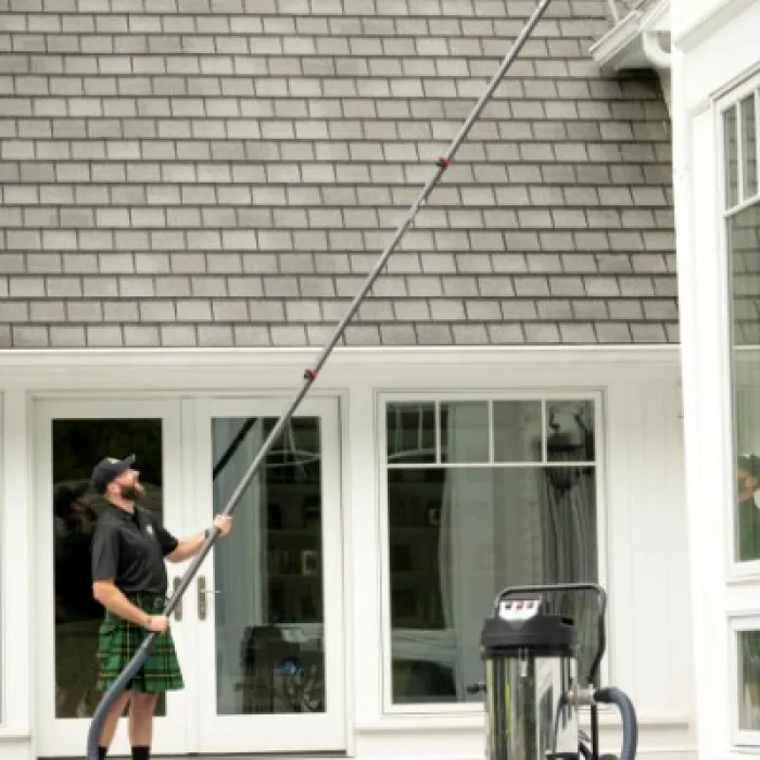 a man holding a large pole