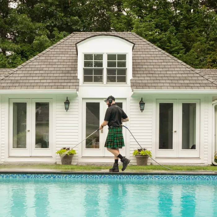 a person standing by a pool