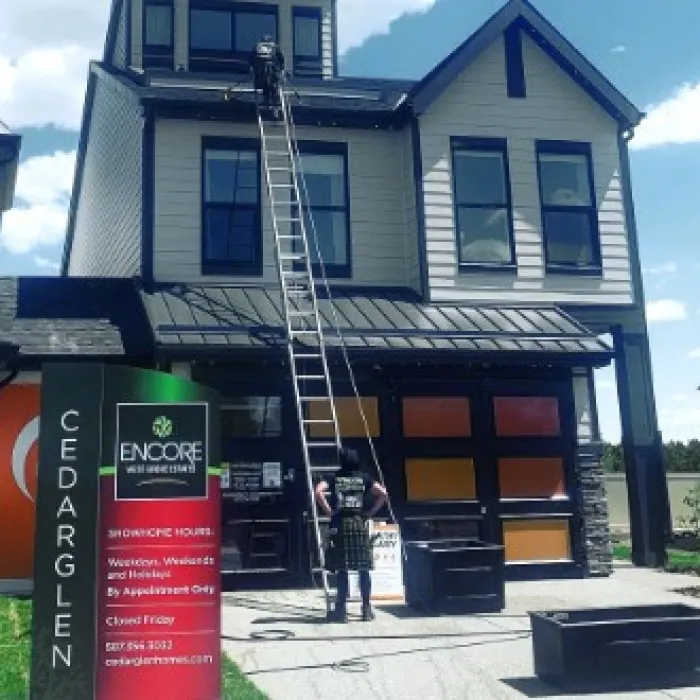 a building with a ladder and a sign in front of it