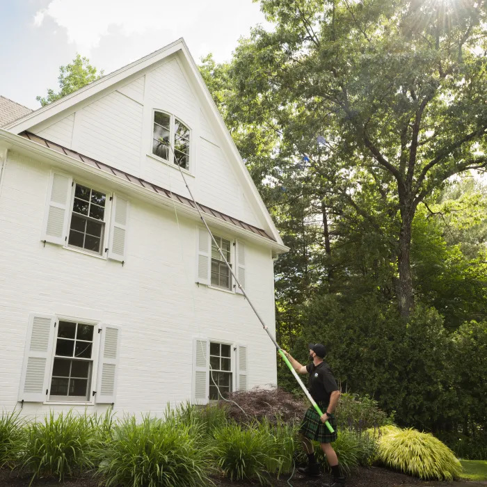 a person standing in front of a house