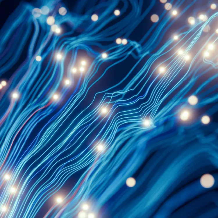 Abstract blue technology background with glowing light streaks and vibrant fiber optic effects.