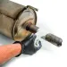 a gloved hand holding a knife