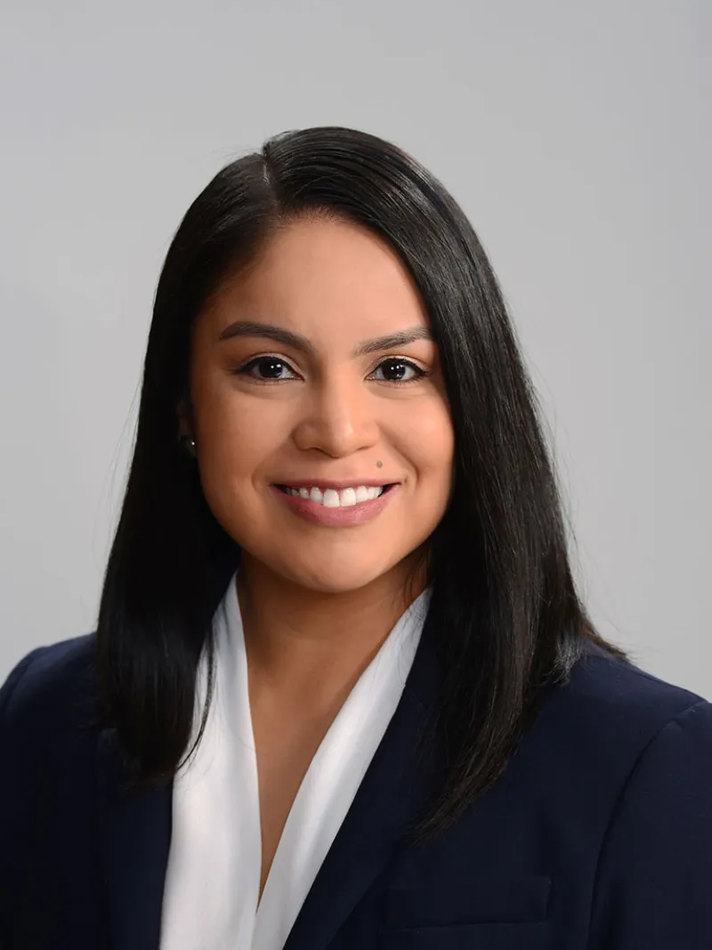 a close-up of a lawyer Shayla Bowles smiling