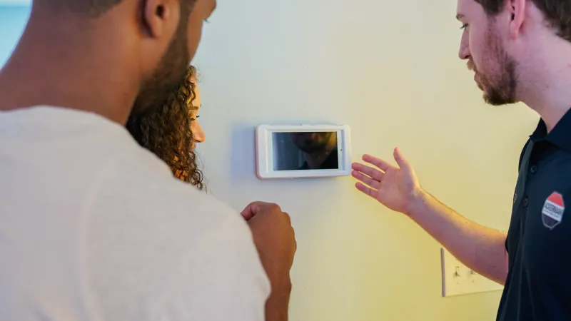 a man holding a framed picture