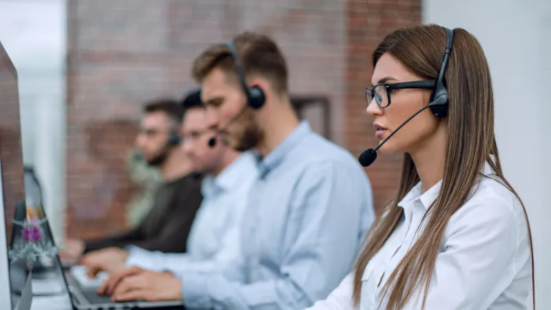 a group of people wearing headsets