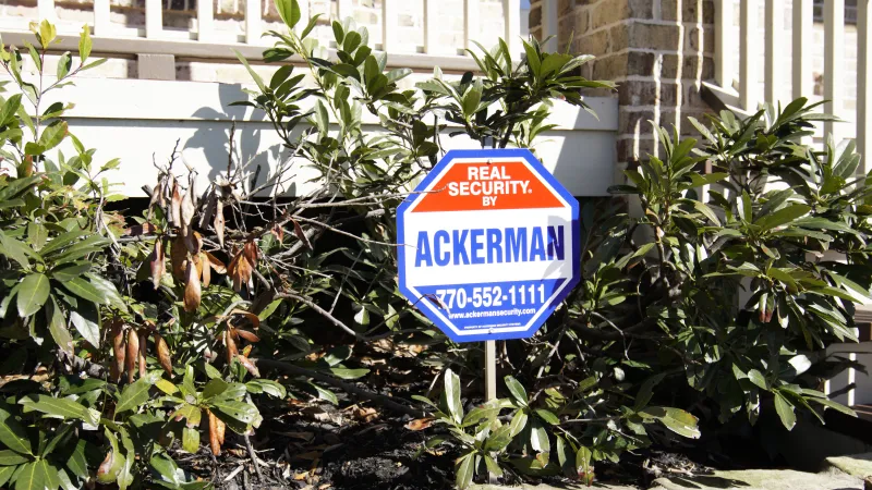 a sign in front of a house