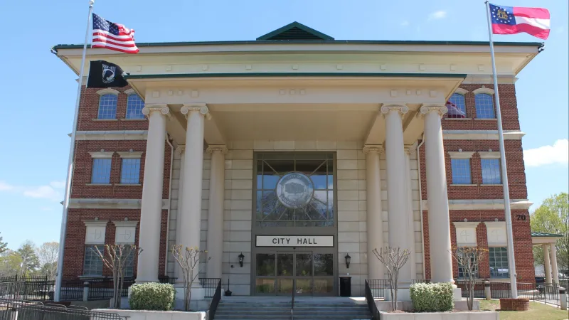 a building with columns and a flag