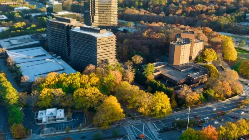 a city with many trees and buildings