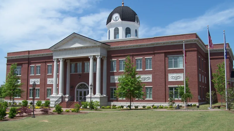 a large brick building with a clock tower