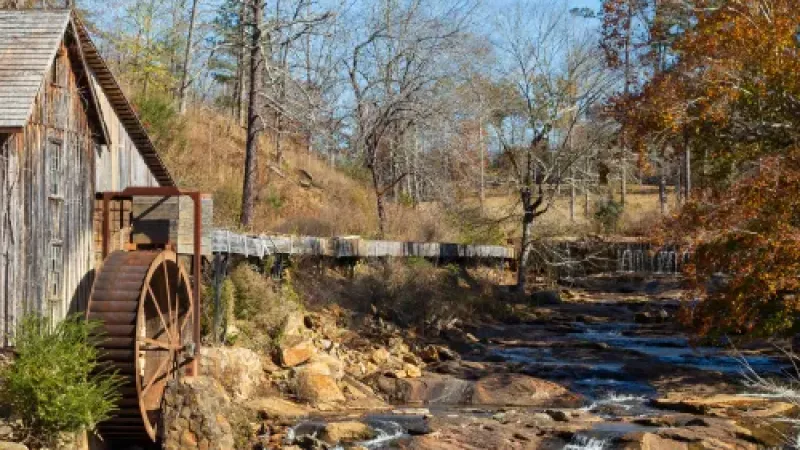 a stream with a bridge over it