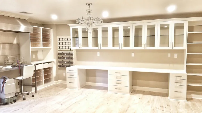 a closet with white cabinets