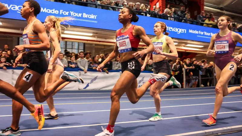 a group of women running on a track