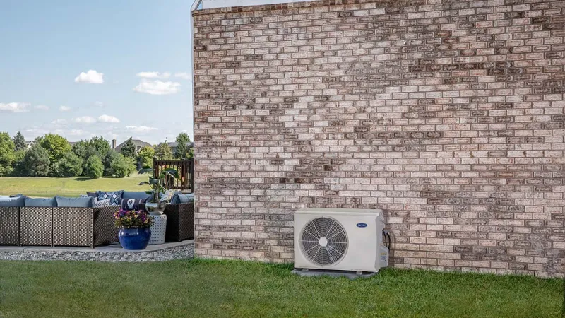 a man and a woman inspecting a vent