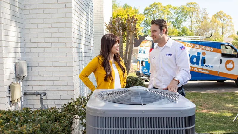 AC technician explaining the issue to the customer