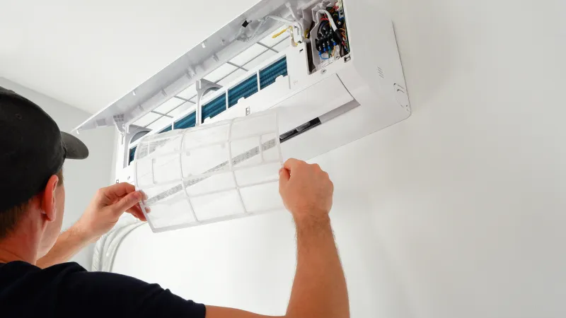 a man drawing on a white board