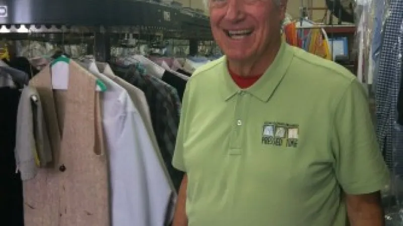 a man standing in a clothing store