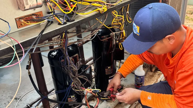 Estes Commercial Tech changing a Compressor