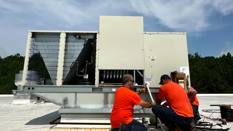 Estes Commercial HVAC Installers on a roof with Heat Pumps