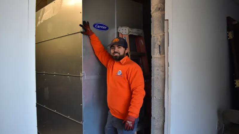 Estes Commercial Technician checking an equipment