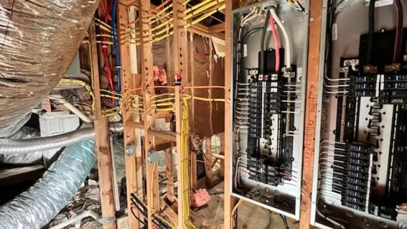 Estes Electrician changing an electrical panel in Lawrenceville