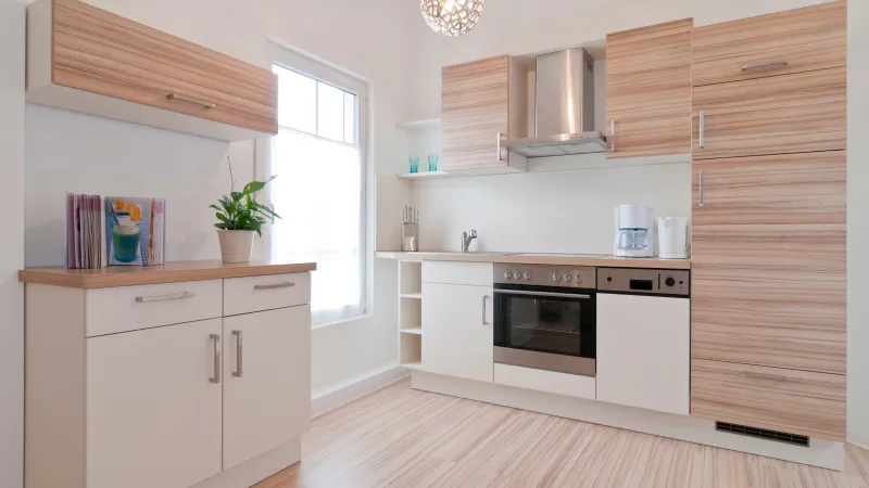 a kitchen with white cabinets
