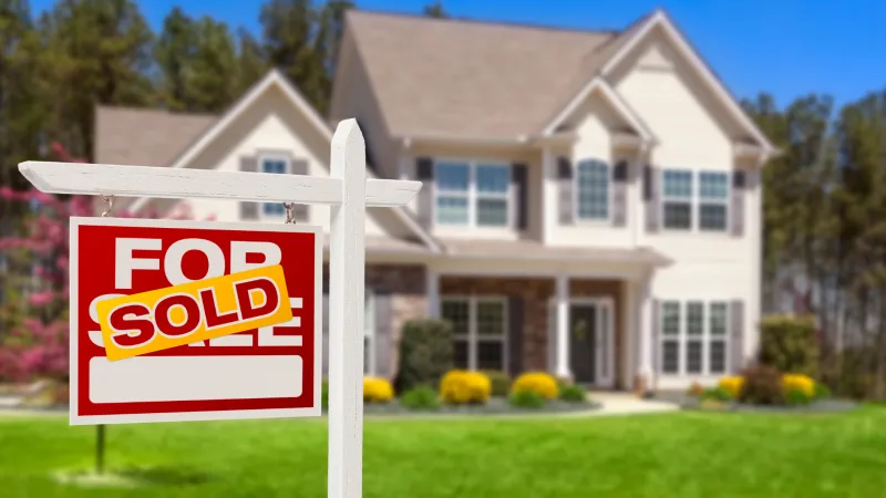 a house with a sign in front