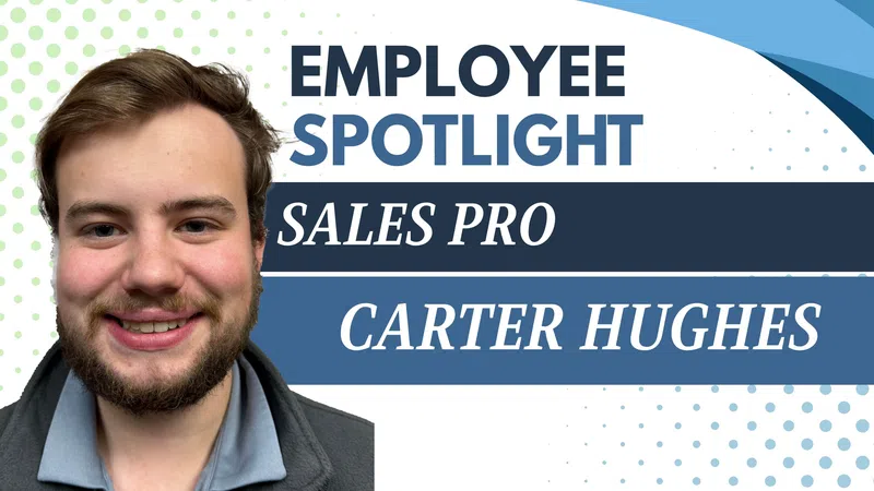 Portrait of a smiling male employee Carter Hughes featured in employee spotlight for sales pro achievements.
