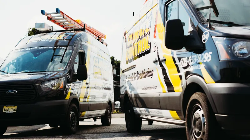 a couple of vans parked next to each other