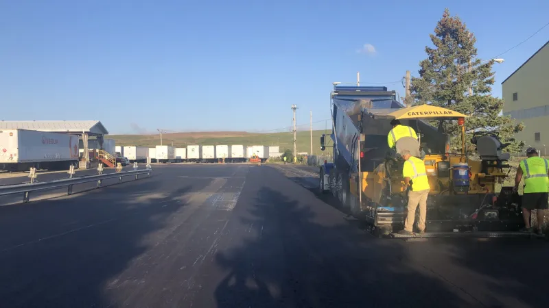 a few men working on a road