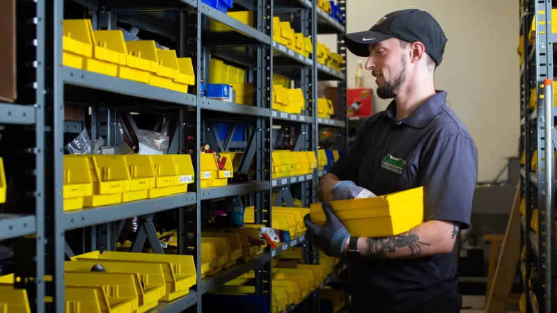 a man holding a yellow box