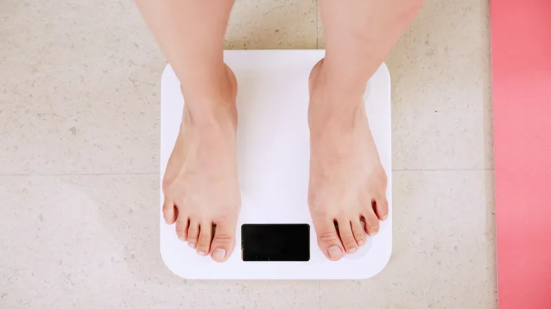 a person's feet on a white surface