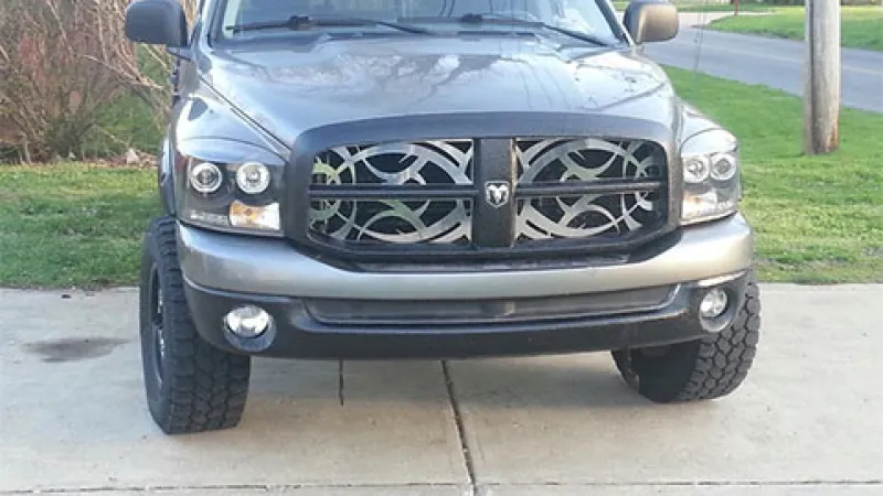 a black car parked on a sidewalk