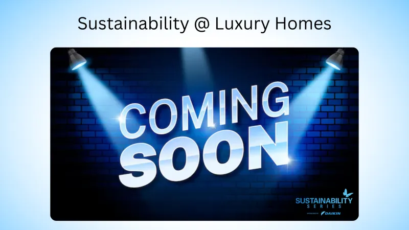 Blue spotlight shines on 'Coming Soon' text on dark brick wall promoting luxury home sustainability series.