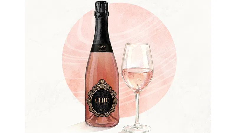 Bottle of rose cava wine beside a filled wine glass with a soft pink circular background.