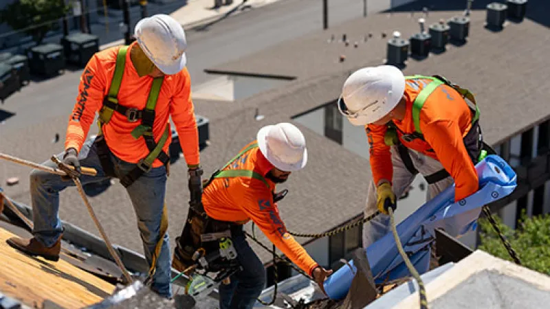 Mattco Roofing crew installing steep slope roof with safety harnesses Texas