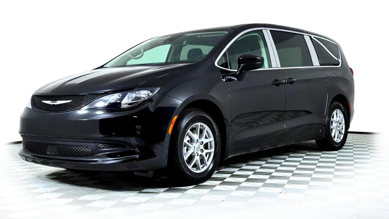 Black Chrysler Pacifica van on a checkered floor, showcasing its sleek design and modern features.