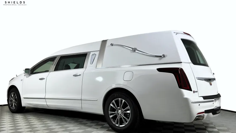 White hearse with sleek design, displaying elegance and professional quality for funeral services.