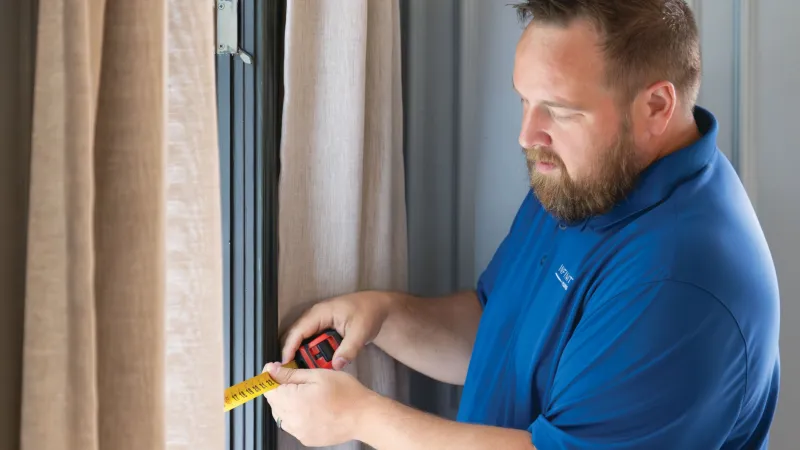 Precision window measurement for custom Infinity by Marvin windows for a Nashville residence to ensure airtight installation