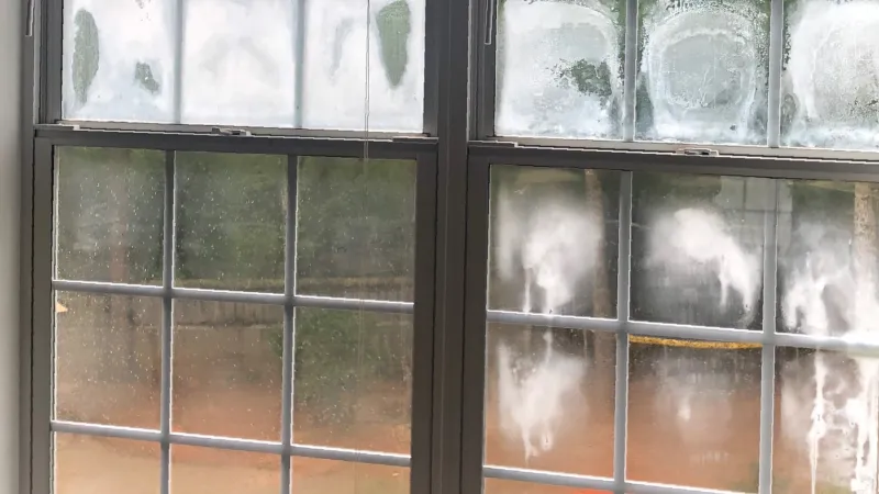 High energy bills causing your house to be cold with ice on the window