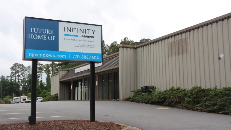 Future home of Infinity by Marvin replacement windows sign outside commercial building.