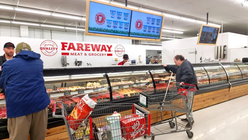 a man pushing a shopping cart