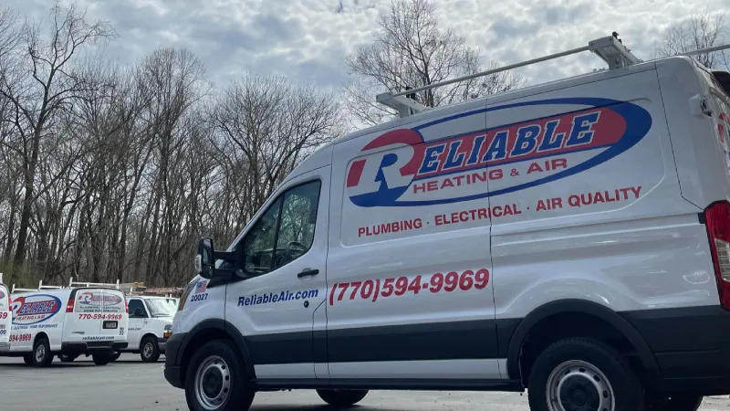 a white truck with a blue logo