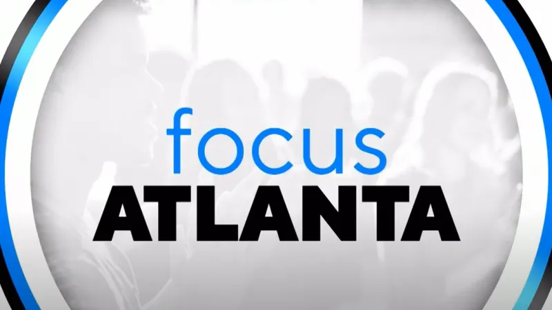 Focus Atlanta logo with blue and black text over blurred grayscale crowd background.
