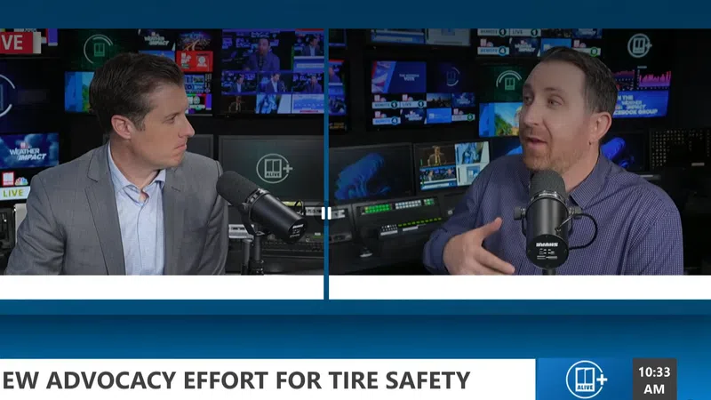 Two men discuss new advocacy efforts for tire safety on a live broadcast with studio equipment in the background.