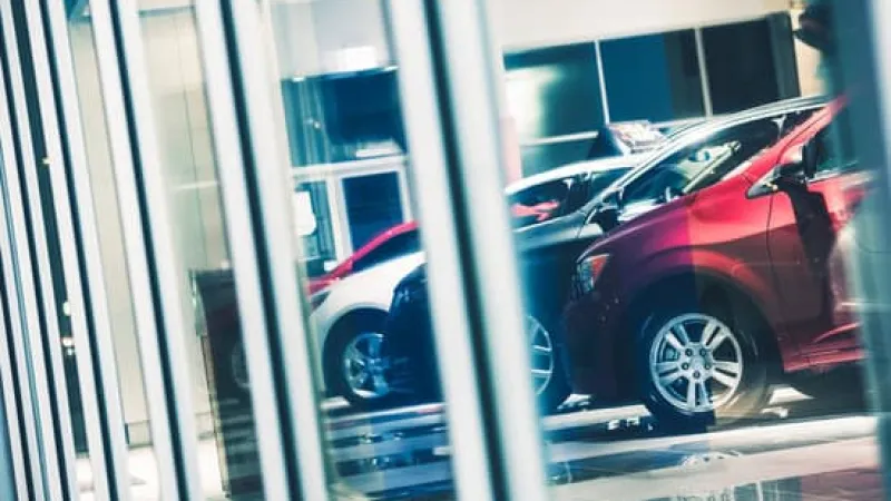 a red car parked in a window