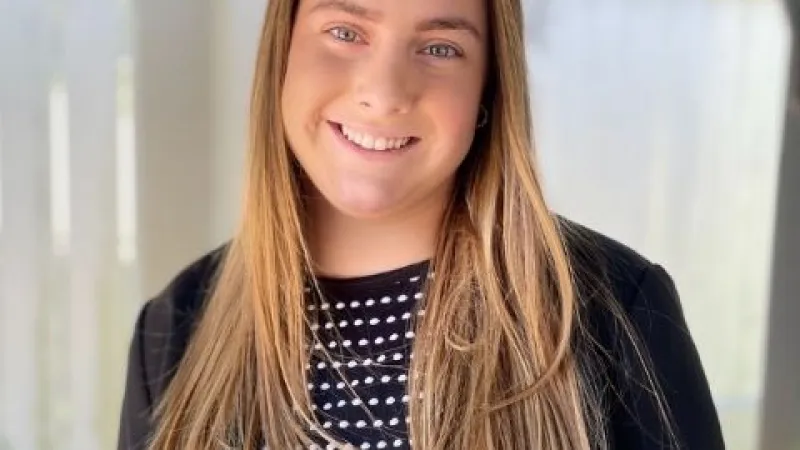 a woman smiling for the camera