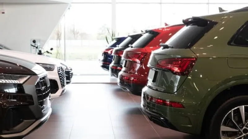 a group of cars parked in a garage