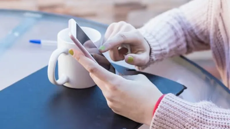a person using a cell phone