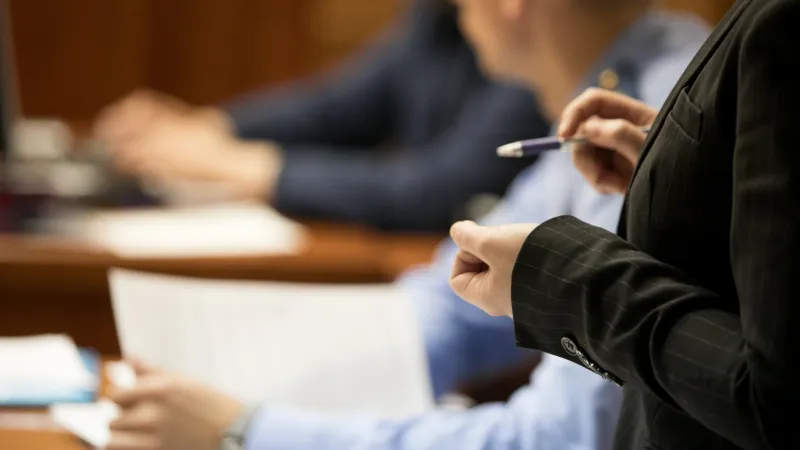 a woman standing up in a courtroom